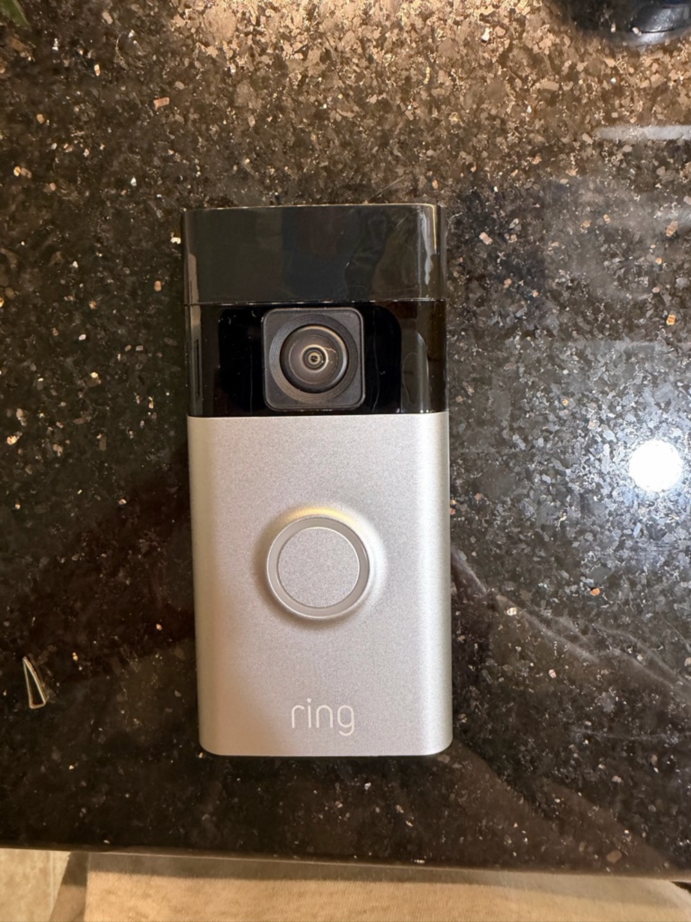 Ring Battery Doorbell Rear Panel in Black with Silver Rails and Orange Label